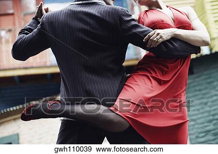 Stock Photo - Man and a woman tangoing. Fotosearch