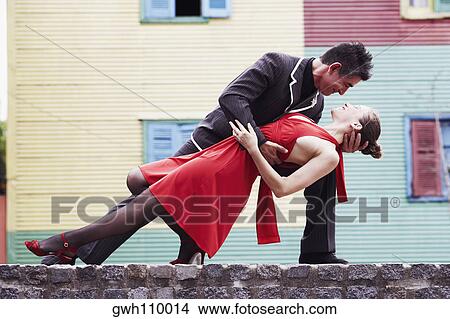 Mature man and a mid adult woman tangoing View Large Photo Image Picture - Mature man and a mid adult woman tangoing. Fotosearch