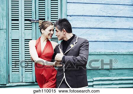 Mature man and a mid adult woman holding hands and looking at each other View Large Photo Image Stock Photography - Mature man and a mid adult woman holding hands and looking at each other. Fotosearch