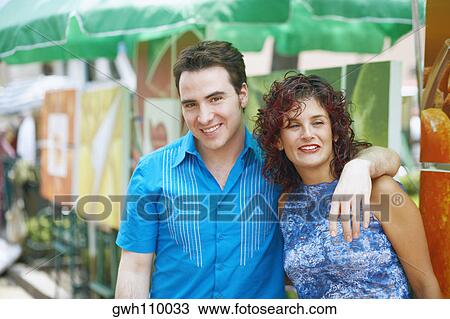 Portrait of a mature woman and a mid adult man smiling View Large Photo Image Stock Image - Portrait of a mature woman and a mid adult man smiling. Fotosearch