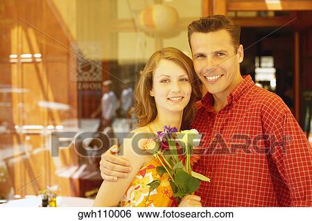 Portrait of a mid adult man and a teenage girl smiling View Large Photo Image Stock Photograph - Portrait of a mid adult man and a teenage girl smiling. Fotosearch