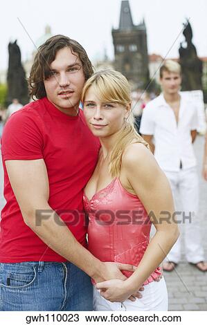 Portrait of a young man embracing a young woman View Large Photo Image Stock Image - Portrait of a young man embracing a young woman . Fotosearch