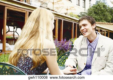 Young couple looking at each other View Large Photo Image Stock Photo - Young couple looking at each other . Fotosearch