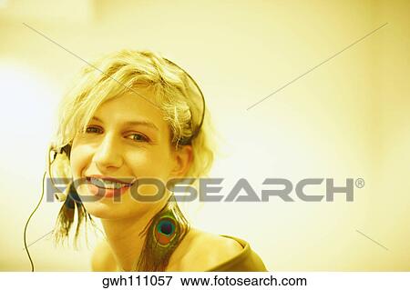 Close-up of a customer service representative wearing a telephone headset View Large Photo Image Stock Photo - Close-up of a customer service representative wearing a telephone headset. Fotosearch