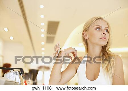 Close-up of a young woman looking away View Large Photo Image Stock Image - Close-up of a young woman looking away. Fotosearch