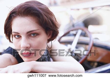 Portrait of a young woman in a car View Large Photo Image Stock Photo - Portrait of a young woman in a car . Fotosearch