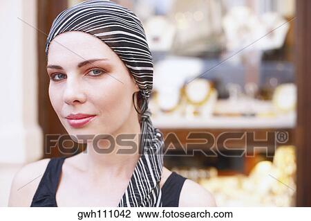 Portrait of a young woman in front of a jewelry store View Large Photo Image Stock Image - Portrait of a young woman in front of a jewelry store . Fotosearch