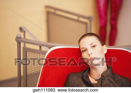 Portrait of a young woman relaxing View Large Photo Image Stock Image - Portrait of a young woman relaxing. Fotosearch