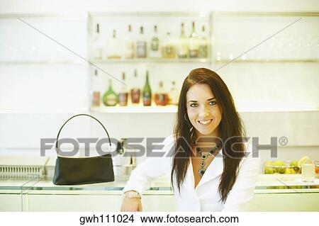 Picture - Portrait of a young woman smiling. Fotosearch