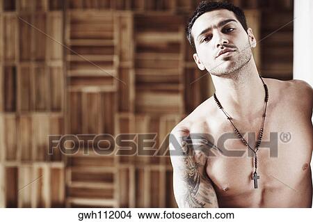 Close-up of a bare chested mid adult man View Large Photo Image Picture - Close-up of a bare chested mid adult man. Fotosearch