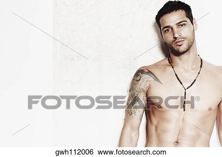 Stock Photograph - Close-up of a bare chested mid adult man. Fotosearch