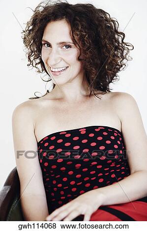 Close-up of a mid adult woman smiling View Large Photo Image Stock Photo - Close-up of a mid adult woman smiling. Fotosearch