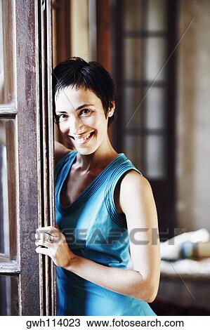 Close-up of a young woman smiling View Large Photo Image Stock Image - Close-up of a young woman smiling. Fotosearch