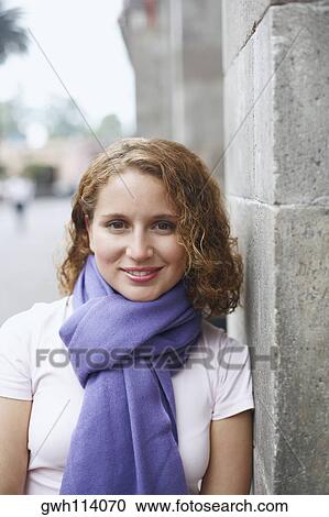 Stock Image - Portrait of a young woman smiling. Fotosearch