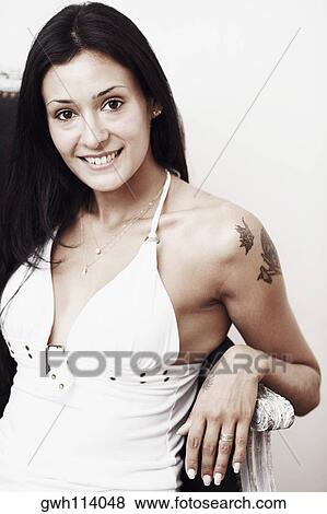Stock Photo - Portrait of a young woman smiling. Fotosearch