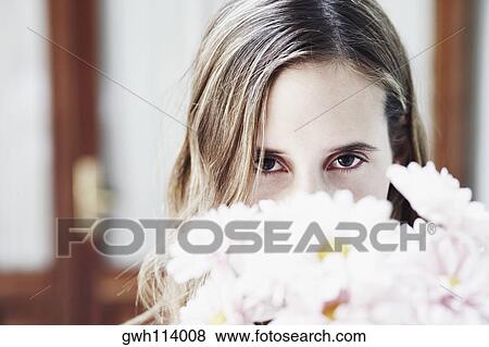 Portrait of a young woman with a bunch flowers View Large Photo Image Stock Photo - Portrait of a young woman with a bunch flowers. Fotosearch