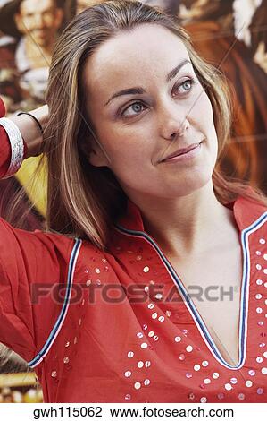Close-up of a young woman thinking View Large Photo Image Stock Image - Close-up of a young woman thinking. Fotosearch