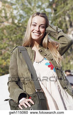 Portrait of a young woman smiling View Large Photo Image Stock Image - Portrait of a young woman smiling . Fotosearch