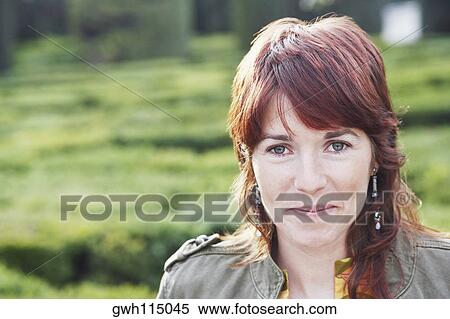 Portrait of a young woman smiling View Large Photo Image Stock Photography - Portrait of a young woman smiling. Fotosearch