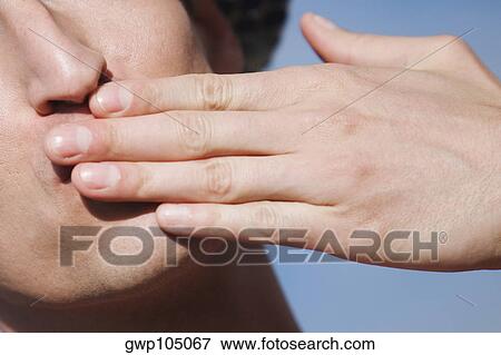Close-up of a gay man blowing a kiss View Large Photo Image Stock Photo - Close-up of a gay man blowing a kiss. Fotosearch