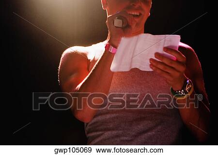 Stock Photo - Close-up of a gay man giving a speech on stage. Fotosearch