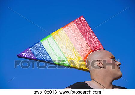 Close-up of a gay man wearing a colorful headdress View Large Photo Image Stock Image - Close-up of a gay man wearing a colorful headdress. Fotosearch