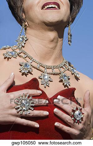 Close-up of a gay man wearing jewelry View Large Photo Image Stock Image - Close-up of a gay man wearing jewelry. Fotosearch