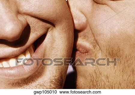 Close-up of a man kissing another man View Large Photo Image Stock Image - Close-up of a man kissing another man. Fotosearch
