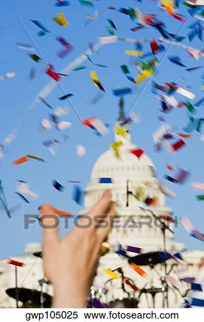 Close-up of a person's hand throwing confetti at a gay parade View Large Photo Image Stock Photography - Close-up of a person's hand throwing confetti at a gay parade. Fotosearch