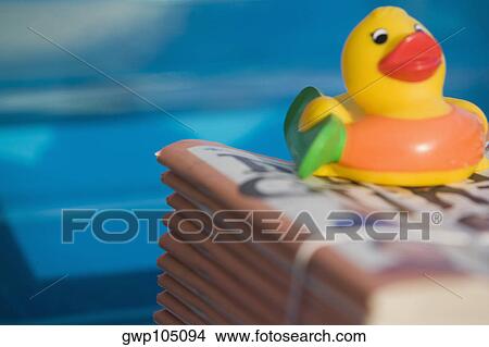 Close-up of a rubber duck on a stack of books View Large Photo Image Picture - Close-up of a rubber duck on a stack of books. Fotosearch