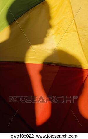 Close-up of the shadow of two people on a gay pride flag View Large Photo Image Stock Image - Close-up of the shadow of two people on a gay pride flag. Fotosearch