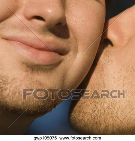 Close-up of two gay men kissing View Large Photo Image Stock Photograph - Close-up of two gay men kissing. Fotosearch