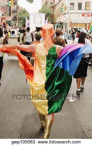 Group of people walking on the street at a gay parade View Large Photo Image Stock Image - Group of people walking on the street at a gay parade. Fotosearch