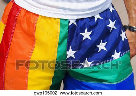 Mid section view of a man wearing multi-colored shorts View Large Photo Image Stock Image - Mid section view of a man wearing multi-colored shorts. Fotosearch