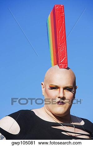 Portrait of a gay man wearing a colorful headdress View Large Photo Image Stock Image - Portrait of a gay man wearing a colorful headdress. Fotosearch