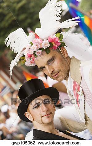 Portrait of two gay men at a gay parade View Large Photo Image Stock Image - Portrait of two gay men at a gay parade. Fotosearch