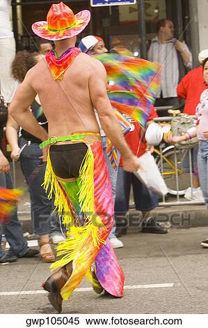 Rear view of a gay man at a gay parade View Large Photo Image Stock Photography - Rear view of a gay man at a gay parade. Fotosearch