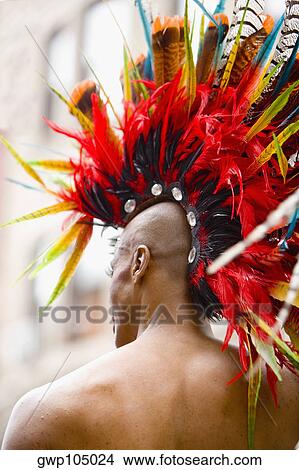 Rear view of a gay man wearing a colorful headdress View Large Photo Image Picture - Rear view of a gay man wearing a colorful headdress. Fotosearch