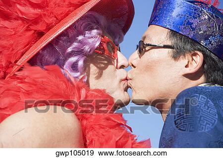 Side profile of two gay men kissing each other View Large Photo Image Stock Photo - Side profile of two gay men kissing each other. Fotosearch