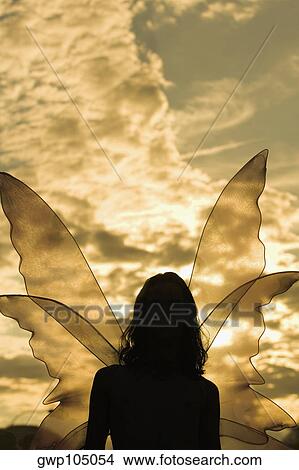 Picture - Silhouette of a lesbian woman in a fairy costume. Fotosearch