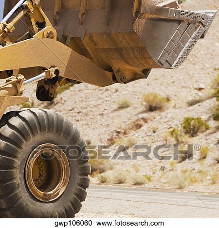 Close-up of a bulldozer at a construction site View Large Photo Image Stock Image - Close-up of a bulldozer at a construction site. Fotosearch