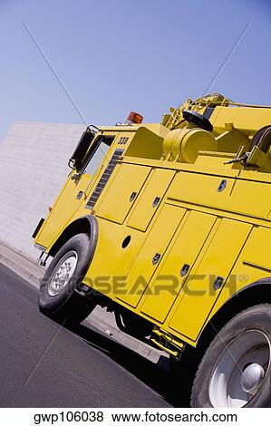 Close-up of a crane on a road View Large Photo Image Stock Photo - Close-up of a crane on a road. Fotosearch