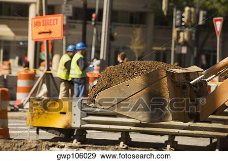Close-up of the scoop of an earth mover carrying soil View Large Photo Image Stock Photo - Close-up of the scoop of an earth mover carrying soil. Fotosearch