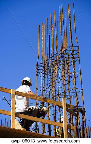 Low angle view of workers at a construction site, Miami, Florida, USA View Large Photo Image Stock Image - Low angle view of workers at a construction site, Miami, Florida, USA. Fotosearch
