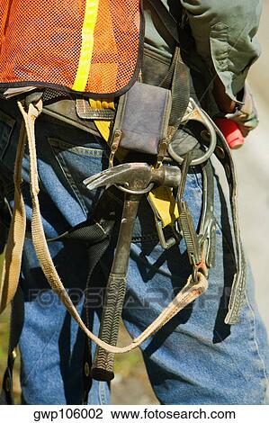 Mid section view of a construction worker View Large Photo Image Stock Image - Mid section view of a construction worker. Fotosearch