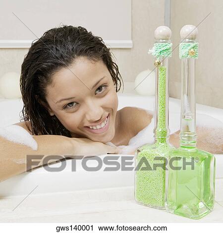 Portrait of a teenage girl having a bath View Large Photo Image Stock Image - Portrait of a teenage girl having a bath. Fotosearch