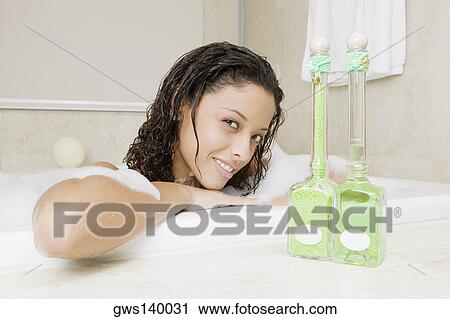 Portrait of a teenage girl having a bath View Large Photo Image Stock Image - Portrait of a teenage girl having a bath. Fotosearch