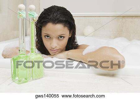 Portrait of a teenage girl having a bath View Large Photo Image Stock Photography - Portrait of a teenage girl having a bath. Fotosearch