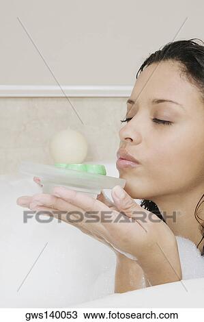 Side profile of a teenage girl holding a soap dish View Large Photo Image Stock Image - Side profile of a teenage girl holding a soap dish. Fotosearch