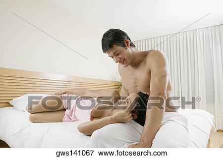 Close-up of a teenage girl lying on a mid adult man's lap View Large Photo Image Stock Photo - Close-up of a teenage girl lying on a mid adult man's lap. Fotosearch